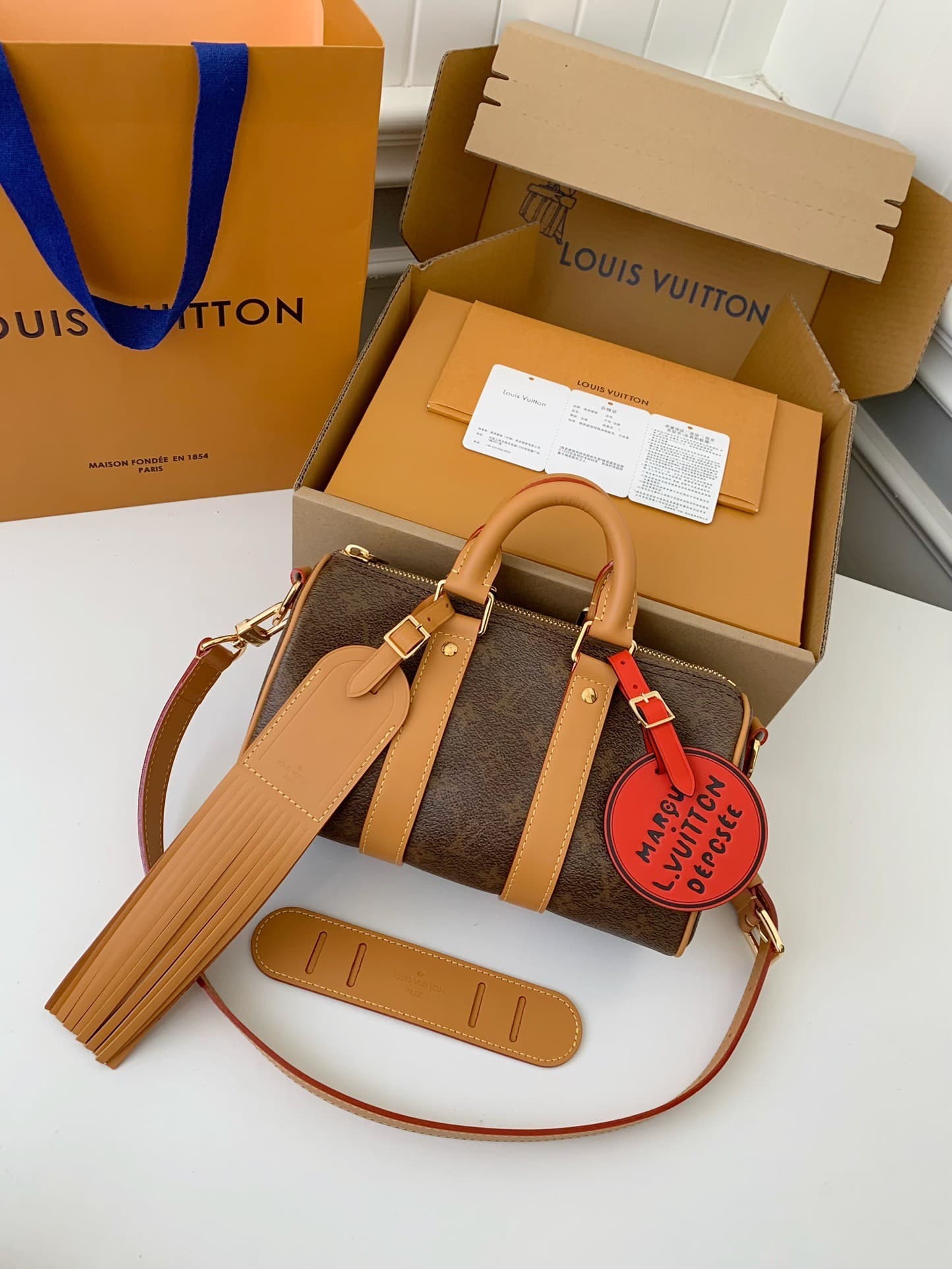 L X V The New Keepall Bandouli ère 25 handbag M11542 Size:25*15*11cm