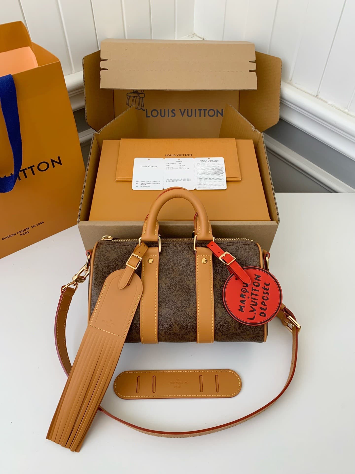 L X V The New Keepall Bandouli ère 25 handbag M11542 Size:25*15*11cm