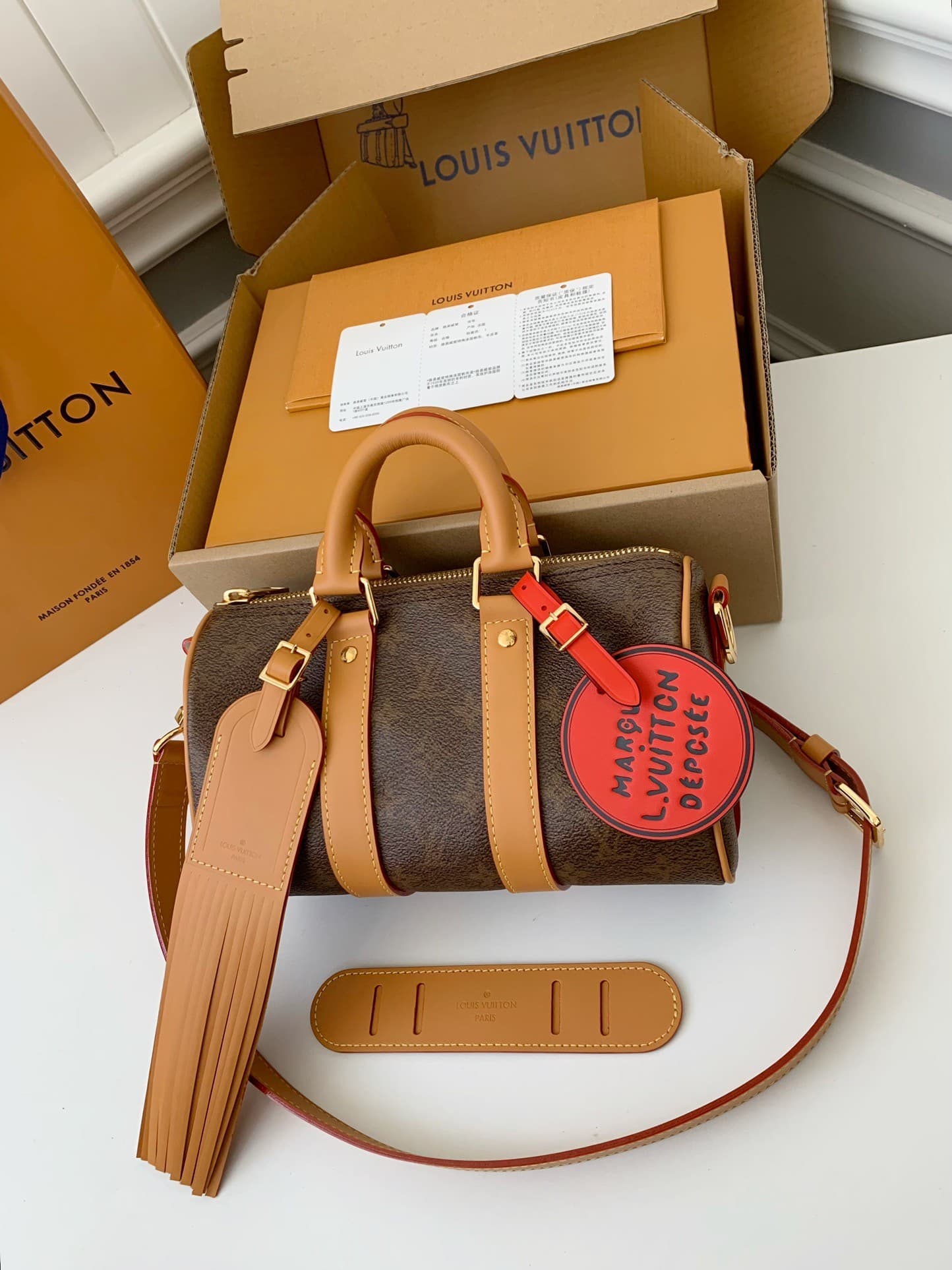 L X V The New Keepall Bandouli ère 25 handbag M11542 Size:25*15*11cm